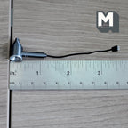 1:12 scale miniature hair dryer in black and silver with a black cord and plug, shown with a ruler