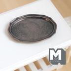 1:12 scale miniature metal oval serving tray with scalloped rim, large, dark bronze style finish, on a white table