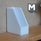 1:12 scale miniature magazine file holder in white, office desk organizer with slanted sides, shown on a wood shelf
