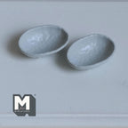 1:12 scale miniature irregular textured bowls in cool gray, style F, set of 2, oval with uneven rims, on a white table
