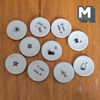 1:12 scale miniature cat and star doodle plates in light gray, large, set of 10, black line drawings, on a wood surface