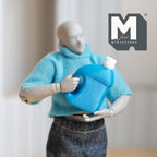 1:12 scale miniature fabric softener bottle in blue with a removable white cap and side handle, held by a posable figure