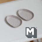 1:12 scale miniature metal irregular shaped food trays in warm gray, set of 2, shown from above on a white table
