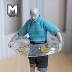 1:12 scale miniature round pool float in clear with a yellow duck print, shown worn by a poseable figure for scale