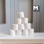 1:12 scale miniature toilet paper rolls in white, set of 10, shown stacked in a pyramid on a white table