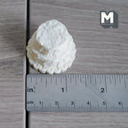1:12 scale miniature unfrosted tiered cake with crumb coat in cream resin, three rough layers, shown with a ruler