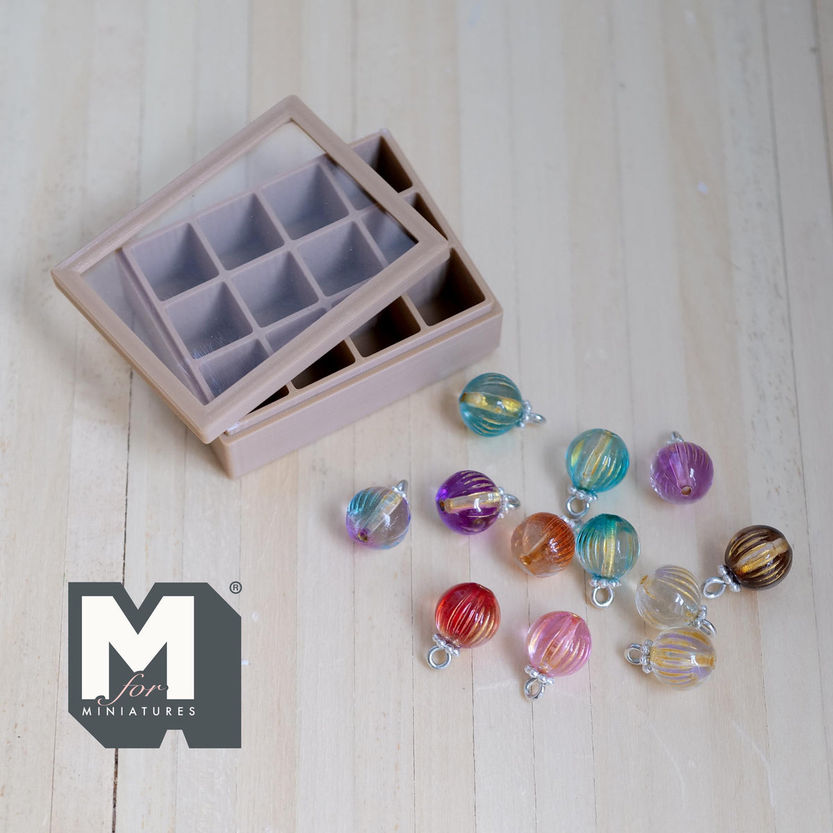 1:12 scale miniature glass Christmas balls in 12 assorted colors with swirl stripes and silver caps, in a storage box with a clear window lid