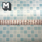1:12 scale miniature embossed square mosaic tile sheet in blue, aqua and white checks, shown with a ruler