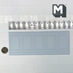 1:12 scale miniature raised rectangle wainscot panel in white foamboard, five panel sections, with a ruler and coin