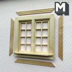 1:12 scale miniature double swing in 8 pane window in bare wood with back trim pieces, shown on patterned wallpaper