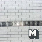 1:12 scale miniature embossed subway tile sheet in white with gray grout lines, close view shown with a ruler