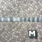 1:12 scale miniature embossed circular cobblestone paving sheet in gray, concentric rings shown with a ruler