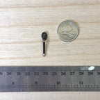 1:12 scale miniature door lever handle with oval backplate in gunmetal, shown beside a coin and a ruler