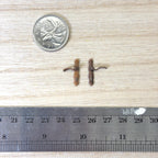 1:12 scale miniature Old English style door lever handles with keyhole in antique copper, set of 2, beside a coin