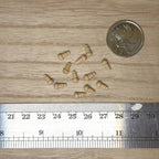 1:12 scale miniature turned wood ball knobs and finials in bare wood, set of 12, shown with a coin and a ruler