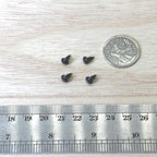 1:12 scale miniature mushroom knobs in matte black, set of 4, shown on a wood surface beside a coin and a ruler