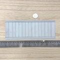 1:12 scale miniature light gray foamboard wainscot panel with embossed vertical planks, wood grain and thin top and bottom rails