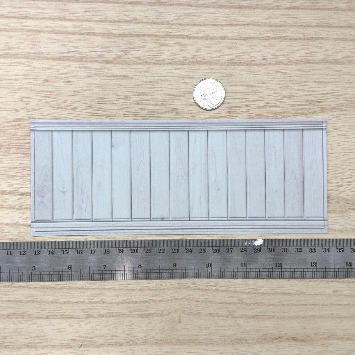 1:12 scale miniature light gray foamboard wainscot panel with embossed vertical planks, wood grain and thin top and bottom rails