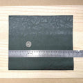 Dark green faux leather sheet with soft pebbled grain and a low-sheen matte surface, 10-7/16 x 8-7/8 inch