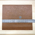 Brown faux leather sheet with soft pebbled grain and a low-sheen matte surface, 10-7/16 x 8-7/8 inch