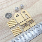 1:12 scale miniature unpainted wood house lantern with round and arched windows, a slatted roof and an LED bulb glowing inside