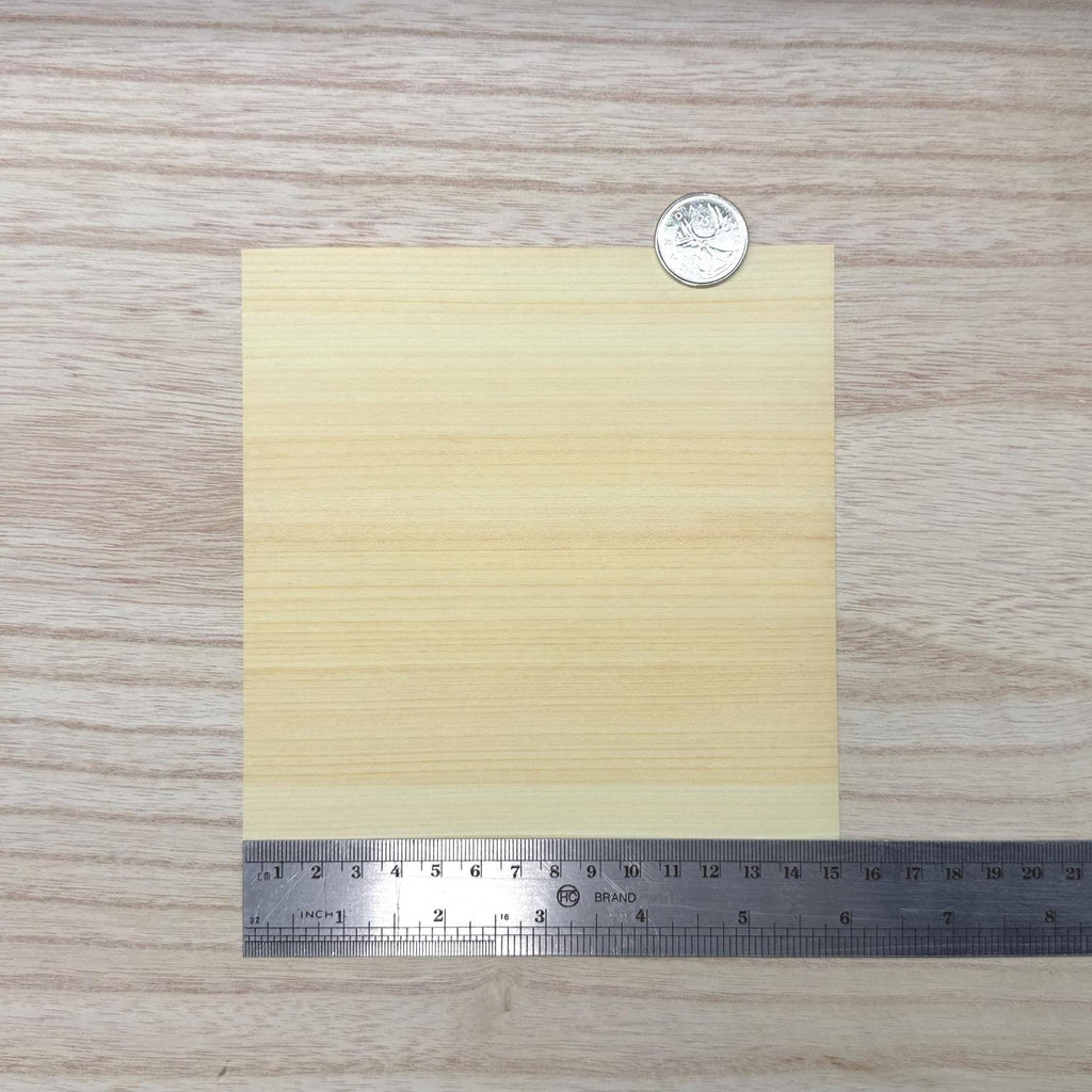 Miniature hinoki cypress wood veneer sheet in pale creamy yellow with fine even straight grain, 5-7/8 inch square