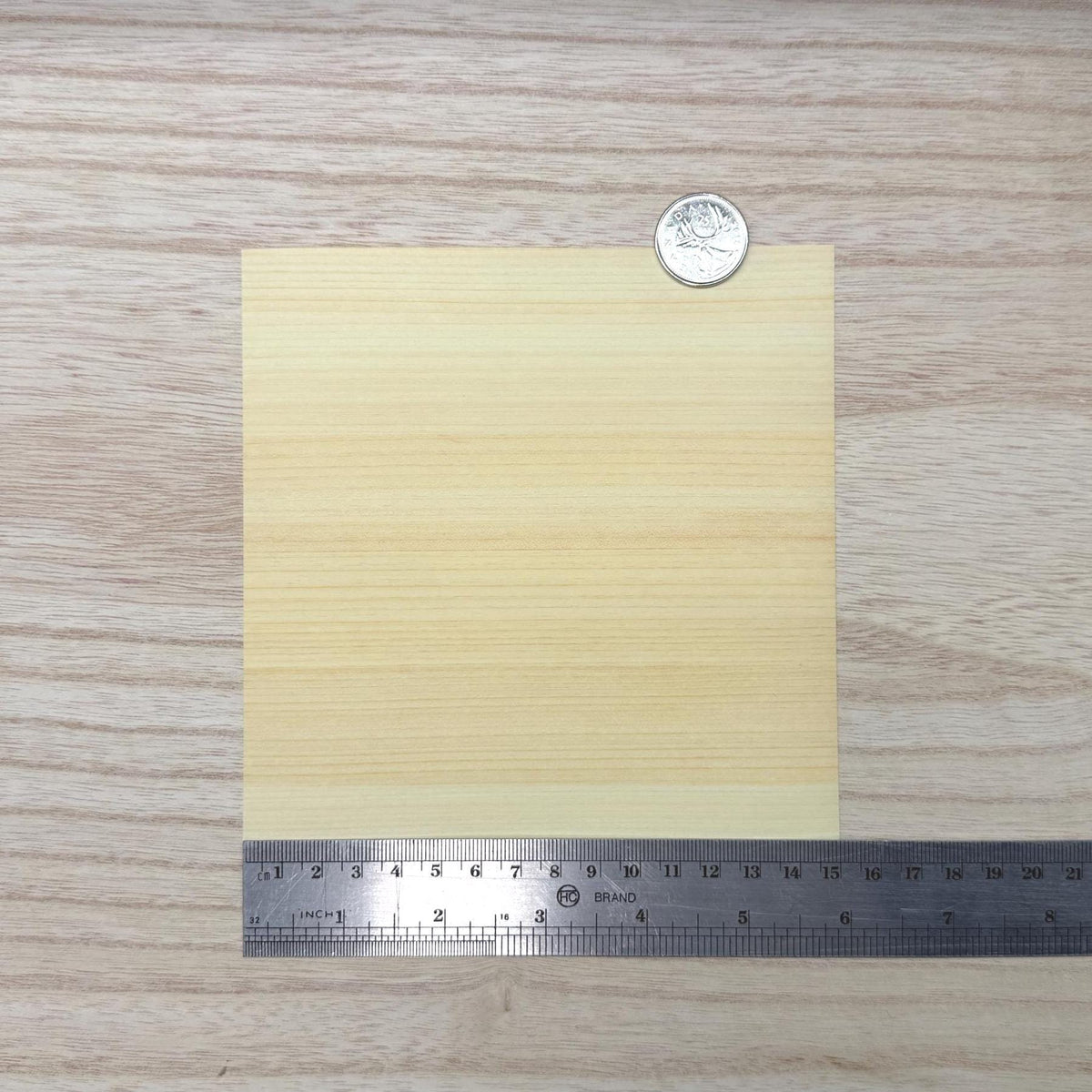 Miniature hinoki cypress wood veneer sheet in pale creamy yellow with fine even straight grain, 5-7/8 inch square