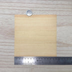 Miniature Douglas fir wood veneer sheet in warm honey amber with straight tightly spaced grain, 5-7/8 inch square