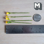 1:12 scale miniature yellow lily flower stems with red speckled petals, one closed bud and small green leaves